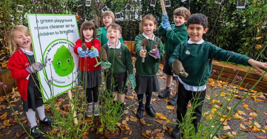 Pupils from Hunter's Bar stand proudly in the school garden, funded by donations to the Home Association.