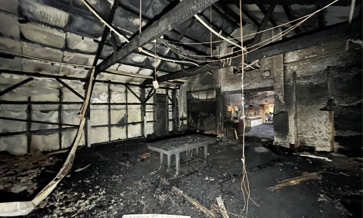 The blackened and charred interior of a room within Frogmore paper mill that was devastated by fire